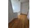 Upstairs hallway with hardwood floors and access to bedrooms at 19877 E 40Th Ave, Denver, CO 80249