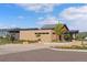 Exterior view of the clubhouse features modern architecture, beautiful landscaping, and ample parking at 11103 Cloud Shadow St, Littleton, CO 80125