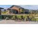 Modern clubhouse features outdoor seating, a grassy area, and stylish architecture at 11103 Cloud Shadow St, Littleton, CO 80125