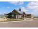 Exterior of the clubhouse features modern architecture, large windows, landscaping, and ample parking at 11103 Cloud Shadow St, Littleton, CO 80125