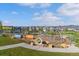 Community playground with colorful play structures, climbing ropes, and ample space for children at 11103 Cloud Shadow St, Littleton, CO 80125