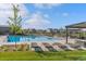 Resort style pool with lounge chairs and pergola in a Gathering-friendly neighborhood at 11103 Cloud Shadow St, Littleton, CO 80125