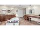 Luxurious bathroom featuring soaking tub, dual sinks, vanity, and wood floors at 3577 S Hillcrest Dr, Denver, CO 80237