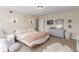 Bright bedroom with neutral colors, comfortable seating, and natural light at 3577 S Hillcrest Dr, Denver, CO 80237