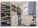 Walk-in closet with custom shelving, drawers, and storage solutions at 3577 S Hillcrest Dr, Denver, CO 80237