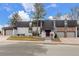 Stunning exterior featuring white painted brick and a prominent tree in a well-manicured front yard at 3577 S Hillcrest Dr, Denver, CO 80237