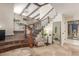 Grand foyer featuring a staircase, stone accent wall, and wood beam ceilings at 3577 S Hillcrest Dr, Denver, CO 80237