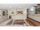 Cozy living room with a stone accent wall, built-in cabinets, and a wet bar for entertaining guests at 3577 S Hillcrest Dr, Denver, CO 80237