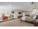 Expansive main bedroom with a cozy fireplace, a seating area, and a large bed, creating a relaxing retreat at 3577 S Hillcrest Dr, Denver, CO 80237