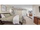 Large primary bedroom suite with a fireplace and seating area, complete with a sliding barn door at 3577 S Hillcrest Dr, Denver, CO 80237