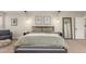 Bright main bedroom with stylish decor, featuring a seating area and a large bed with natural light at 3577 S Hillcrest Dr, Denver, CO 80237