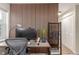 Office space featuring a wooden slat accent wall, modern furniture, and ample storage and lighting at 3577 S Hillcrest Dr, Denver, CO 80237