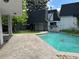 A beautiful swimming pool with a stamped concrete surround offers refreshing outdoor living at 3577 S Hillcrest Dr, Denver, CO 80237
