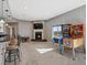 Finished basement with a stone fireplace, pinball machines, and wet bar at 10531 Lieter Pl, Lone Tree, CO 80124