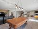 Open basement area with pool table, bar area and lounging area perfect for entertaining guests and relaxing at 10531 Lieter Pl, Lone Tree, CO 80124