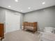 Bedroom with a wood crib and closet perfect for newborns and young children at 10531 Lieter Pl, Lone Tree, CO 80124