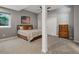 Bedroom with a comfortable bed, a dresser, and a window offering natural light at 10531 Lieter Pl, Lone Tree, CO 80124