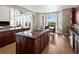 Gourmet kitchen with granite countertops and a gas cooktop island at 10531 Lieter Pl, Lone Tree, CO 80124