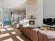 Cozy living room with a stone fireplace and comfortable seating at 10531 Lieter Pl, Lone Tree, CO 80124