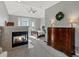 Main bedroom boasts a fireplace, a ceiling fan, plush carpeting and a decorative wreath at 10531 Lieter Pl, Lone Tree, CO 80124