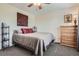 Cozy bedroom featuring a queen-sized bed, soft lighting, and neutral decor at 5604 S Lisbon Way, Centennial, CO 80015