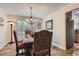Inviting dining room with hardwood floors, a chandelier, and a window providing natural light at 5604 S Lisbon Way, Centennial, CO 80015