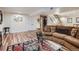 Finished basement offers versatile living with a large sectional sofa, Murphy bed and bar area at 5604 S Lisbon Way, Centennial, CO 80015
