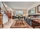 Comfortable living room with hardwood floors, a large window, and stylish furnishings at 5604 S Lisbon Way, Centennial, CO 80015