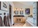 Main bathroom with double sink vanity with granite top and decorative backsplash at 5604 S Lisbon Way, Centennial, CO 80015