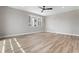 Primary bedroom features hard wood floors, a ceiling fan, and a double hung window at 888 S Valentia St # 106, Denver, CO 80247