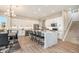 Bright and airy kitchen with a large island, stainless steel appliances, and stylish pendant lighting at 888 S Valentia St # 106, Denver, CO 80247