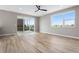 Bright living room with sliding glass door access to the outdoor porch with a brick fireplace at 888 S Valentia St # 106, Denver, CO 80247