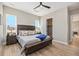 Comfortable main bedroom featuring lots of natural light, wood-look floors and ample closet space at 888 S Valentia St # 106, Denver, CO 80247