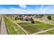 Aerial view of home showcasing property, landscaping, and surrounding neighborhood at 31200 E 145Th Ave, Brighton, CO 80603