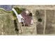 Aerial view showcasing the expansive layout of the home and landscaped outdoor space at 31200 E 145Th Ave, Brighton, CO 80603