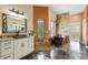 Lavish bathroom with a copper tub, stone accents, and a view of the outdoors offers a relaxing oasis at 31200 E 145Th Ave, Brighton, CO 80603