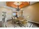 Charming dining room with a chandelier, and views of the sitting room and kitchen at 31200 E 145Th Ave, Brighton, CO 80603