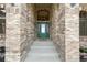 Inviting entryway featuring a beautifully crafted front door and brick facade at 31200 E 145Th Ave, Brighton, CO 80603