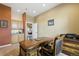 Well-appointed home office features custom wood desk and built-in cabinets and leads to the main bedroom at 31200 E 145Th Ave, Brighton, CO 80603
