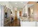 Bright, spacious kitchen with stainless steel appliances, granite countertops, and tile floors at 31200 E 145Th Ave, Brighton, CO 80603