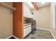 Well-equipped laundry room with modern washer and dryer, sleek countertops, and ample cabinet space at 31200 E 145Th Ave, Brighton, CO 80603
