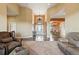 Expansive living area with high ceilings, tile flooring and views into the dining room at 31200 E 145Th Ave, Brighton, CO 80603