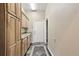 Functional mud room featuring ample cabinet space, granite countertops, and durable tile flooring at 31200 E 145Th Ave, Brighton, CO 80603