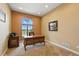 Bright home office with large window, ornate desk, and a peaceful view for productivity at 31200 E 145Th Ave, Brighton, CO 80603