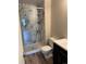 Bathroom features a modern glass-enclosed shower, and sleek vanity at 3460 S Poplar St # 404, Denver, CO 80224