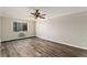 Bright bedroom with wood flooring and large window, perfect for relaxing at 3460 S Poplar St # 404, Denver, CO 80224