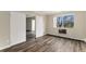 Bedroom with wood floors and a view to the outside at 3460 S Poplar St # 404, Denver, CO 80224