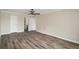 Comfortable bedroom with wood flooring and bathroom access at 3460 S Poplar St # 404, Denver, CO 80224