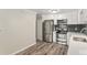 Contemporary kitchen with stainless steel appliances and ample cabinet space at 3460 S Poplar St # 404, Denver, CO 80224