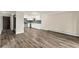 Open-concept living area flows to a bright kitchen with stainless steel appliances at 3460 S Poplar St # 404, Denver, CO 80224